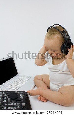 A DJ Baby in headphones listening to music, Shot against a white back ground to provide space for text back ground to provide space for text