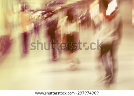motion blur of rush hours in metro, people walking to the exit