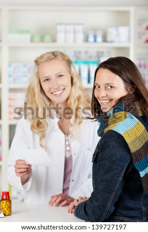 Pharmacist chemist woman looking for medicine in pharmacy drugstore with recipe
