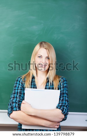 Woman student with white folder background the school board