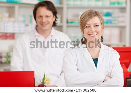 female and male co workers in a pharmacy