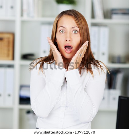 Portrait of shocked businesswoman in formals at office