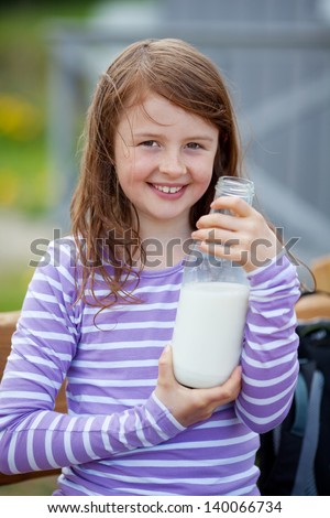 Girl With Milk Bottle At Campsite