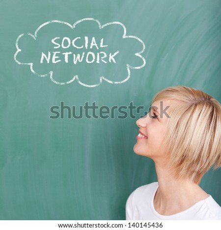 portrait of a smiling student thinking of social network