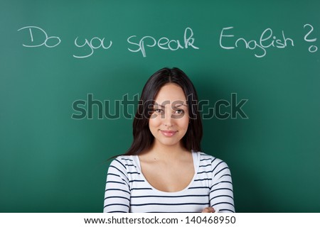 Smiling Female Student In Classroom Learning English