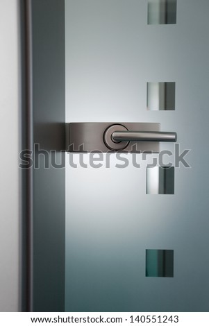 view on an modern doorÃ?Â´s handlle and glass door