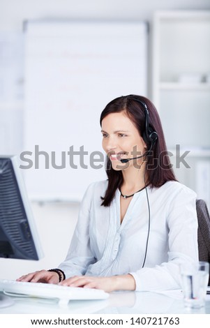 Call center agent working in front of her computer