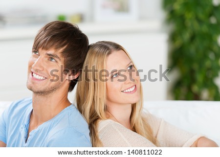 smiling happy couple looking up and dream smiling happy couple looking up and dream