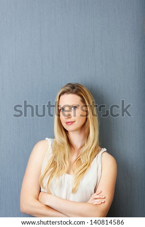woman with folded arms thinking of something