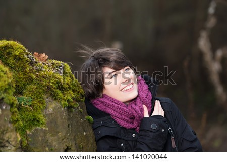 Young girl going for a winter walk wearing warm clothes