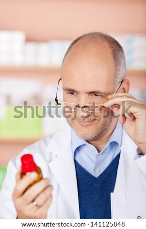 Close up portrait of Pharmacist check the medicine at the drugstore