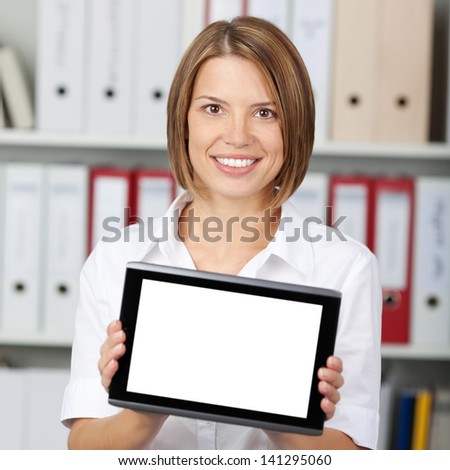 Female secretary showing a digital tablet over the office files background