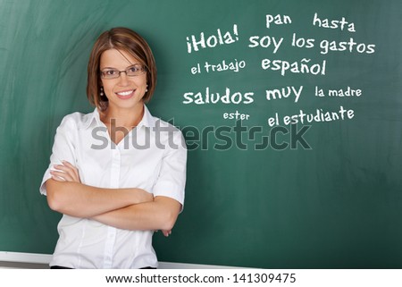 an with glasses teaching Spanish subject at the classroom
