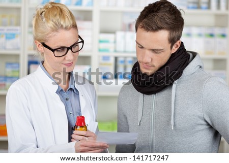 Young male customer buying medicine at the pharmacy
