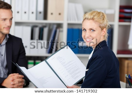 Smiling female recruiter and male candidate during a job interview