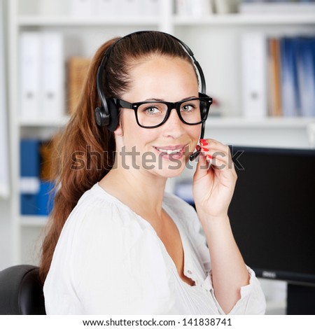 Portrait of a charming young female working in a call center or customer care.