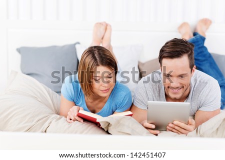Couple is deciding if a book or ebook is better
