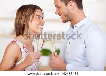 Young in love couple dating with champagne in a close up shot