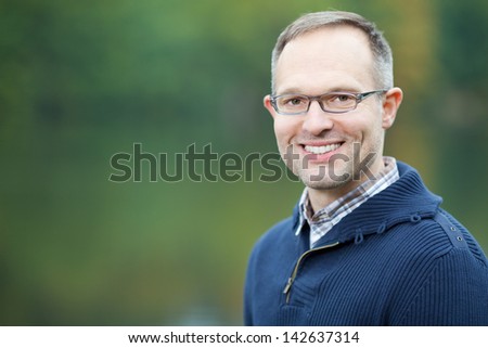 Portrait of confident mature man smiling