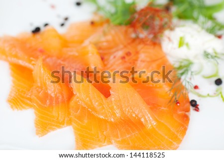 sliced salmon on white dish at fish restaurant