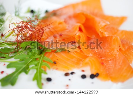 raw salmon slices dish at fish restaurant