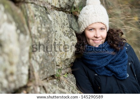 Woman dressed for cold weather with wool hat and scarf