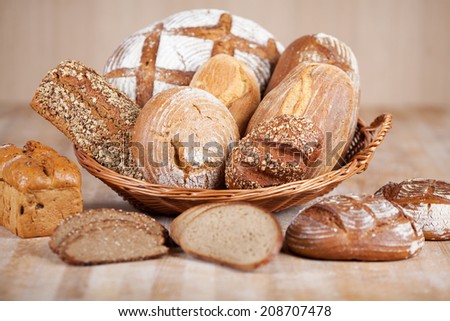 Variety of breads displayed in bread basket at bakery