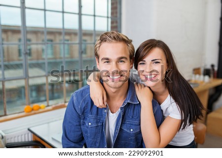 Close up Young Smiling Boyfriend and Girlfriend Inside the House Looking at Camera