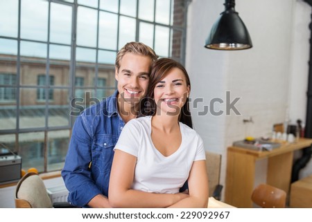 Smiling Young Couple - Boyfriend Embracing Girlfriend From Behind. Captured at the House.