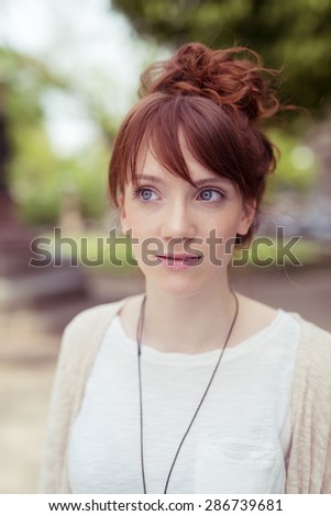 Close up Thoughtful Pretty Young Woman in Casual Clothing, Looking Into Distance Seriously While at Outdoor.