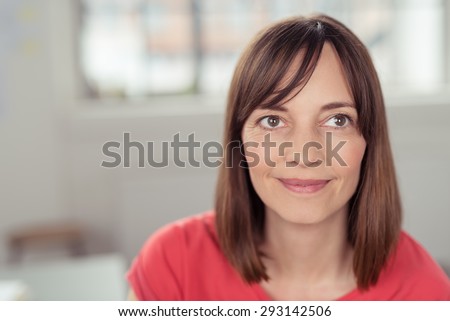 Close up Face of a Thoughtful Pretty Adult Woman Looking Up with a Smile, Emphasizing of Thinking Something Positive.
