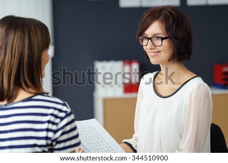 Half Body Shot of Two Professional Office Women Talking About Business Inside the Office.