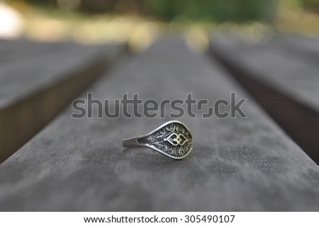 Silver ring on the table.