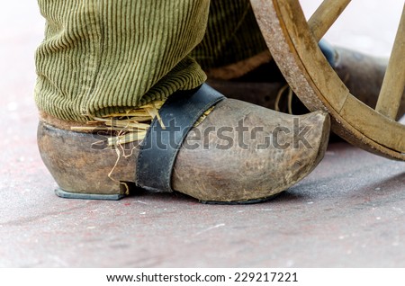 old wooden shoes on foot