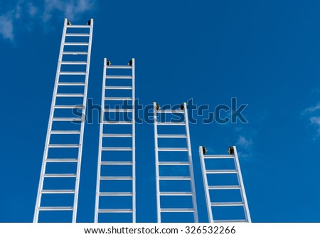 a gradient of aluminum ladders on blue sky