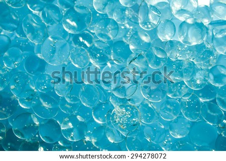 Silica Gel in water with dark blue back ground, shot with macro lens.
