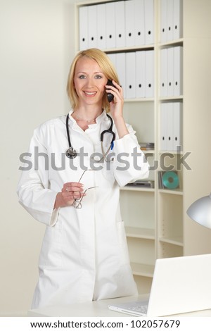 young doctor with telephone