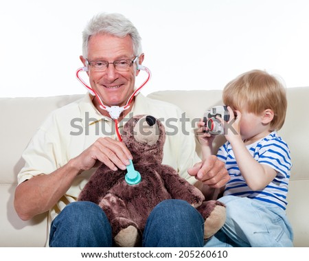 child playing doctor with grandfather
