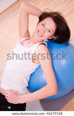 young woman with stability ball sport coach