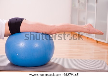 young woman with stability ball sport coach