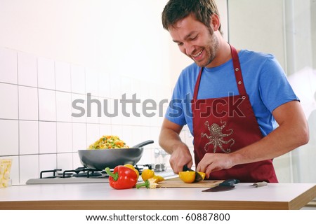 man stand in the kitchen and cook