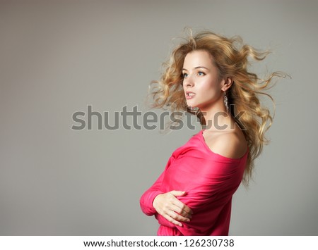 Woman in Pink Blouse on Gray Background