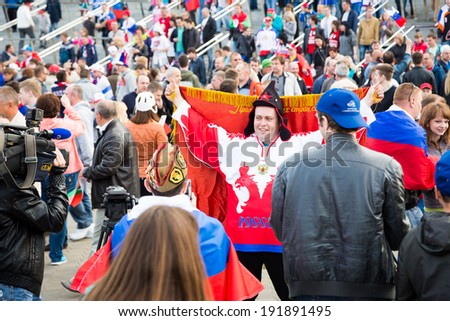 MINSK, BELARUS - MAY 9 - Russian Fans with Flags in Front of Minsk Arena on May 9, 2014 in Belarus. Ice Hockey World Championship (IIHF) Opening.