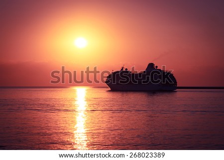 Silhouette of Cruise Ship at Sunset. Luxury Travel Concept. Toned and Filtered Photo. Copy Space.