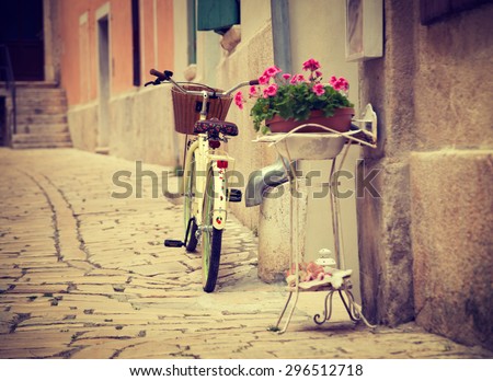 Bicycle on the Street of Medieval Mediterranean Town Rovinj in Istria, Croatia. Popular Tourist Resort at Adriatic Sea. Retro Styled Toned Photo. Shallow Depth of Field.
