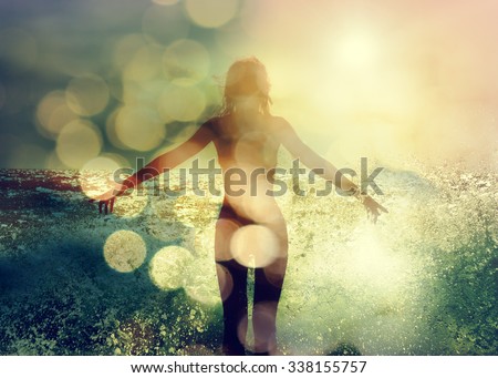 Beautiful Woman Standing in the Sea Waves and Enjoying Sunshine with Open Arms. Double Exposure Filtered Photo with Bokeh.