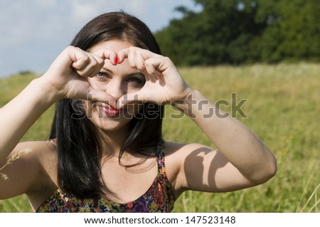 woman showing a loving heart