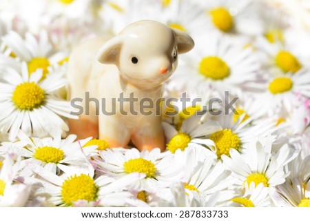ceramic figurine sheep in floral swaddling clothes, version without the bright edges