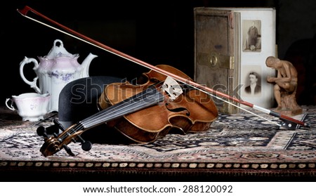 violin - still life with a wooden figure, full color version, due to the character contains grain / noise ratio and enhanced details