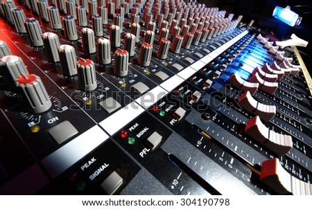 detail sound mixer in red, white and blue light with great perspective, the version with lighting lamp